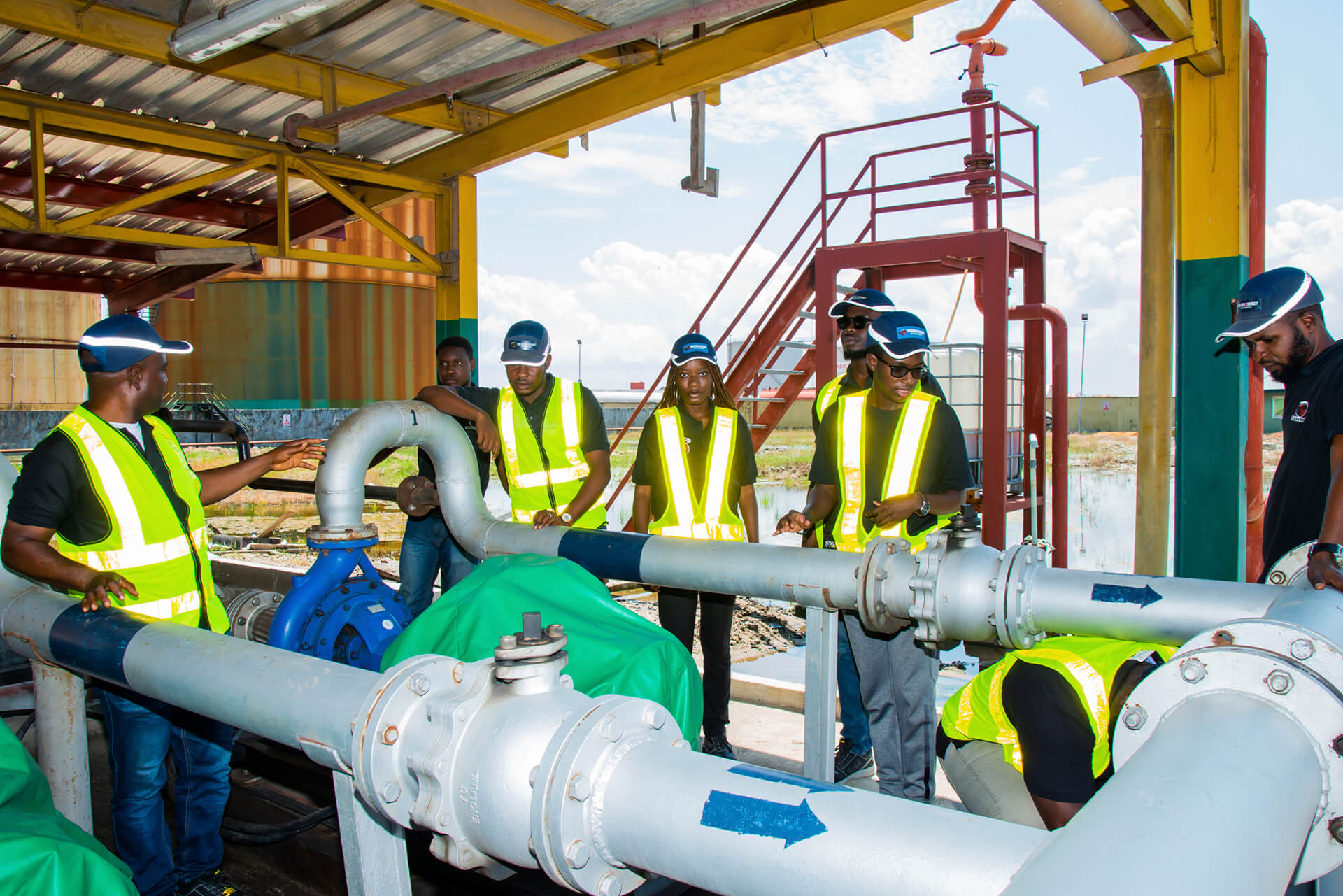 Tulcan energy engineers  looking at a gas pump